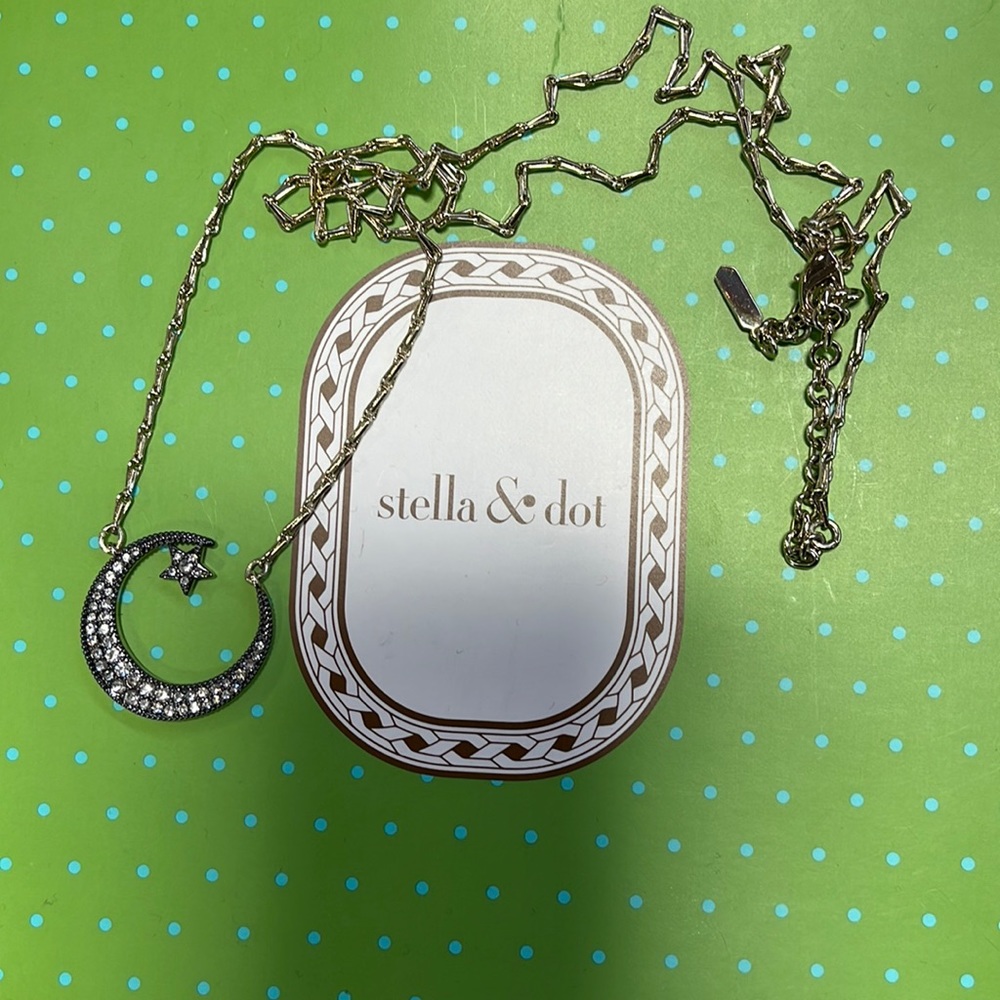 Stella and Dot long length necklace. Crescent moon and star. Hematite and gold.